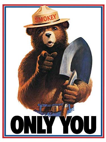 Traditional Smokey Bear sign with shovel.
